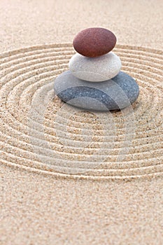 Three coloured round pebbles zen garden