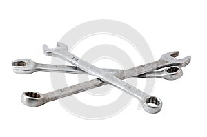 Three combination wrenches on a white background.