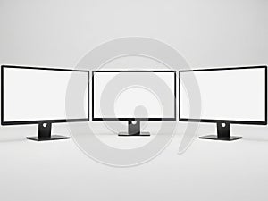 Three computer monitors isolated on white background
