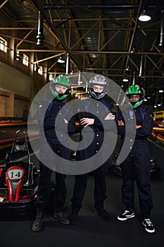 three confident go kart racers in