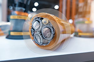 Three-core high-voltage cable with cutaway insulation