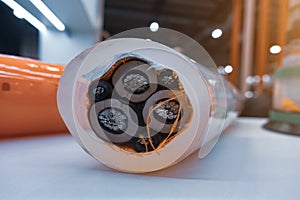 Three-core high-voltage cable with cutaway insulation