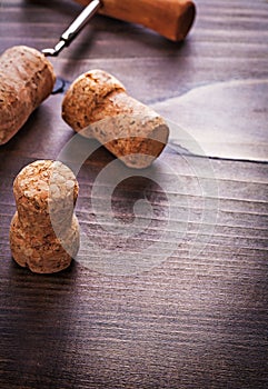 Three corks with corkscrew of champagne on vintage