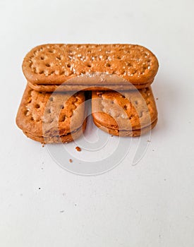 three cracker biscuits filled with chocolate