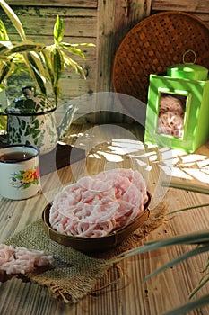 three crackers on a bamboo plate