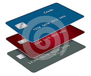 Three credit cards or debit cards, red, green and blue, are seen