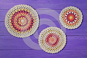 Three crochet pattern coasters