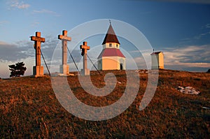 Three crosses and chapel on a hill