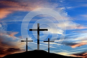 The three crosses of the crucifixion of Jesus Christ are seen in silhouettes