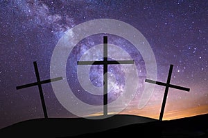 Three crosses on hill top with milky way in background