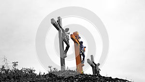 Three Crosses of Jesus Christ on top of the hill in black and white background. Holy week of Easter concept. Good Friday