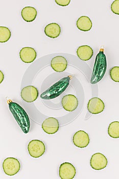 Three cucumber christmas baubles decorated with cucumber slices