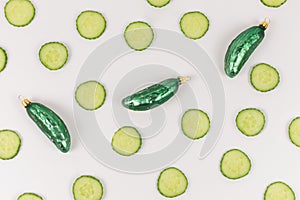 Three cucumber christmas baubles decorated with cucumber slices