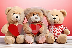 three culturally distinct love teddies sitting together holding hearts
