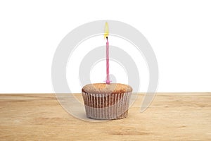 Three cupcakes on a wooden table