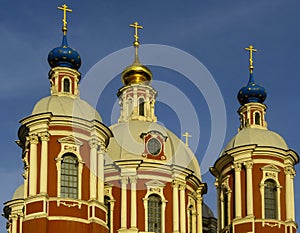 Three cupolas and blue sky. Saint Clement`s church built in 1762 in baroque style, Moscow.
