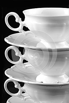 Three cups and saucers photo