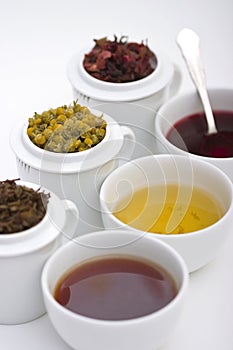 Three cups of tea with three types of herbs