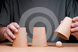 Three cups with wooden ball, Shell Game