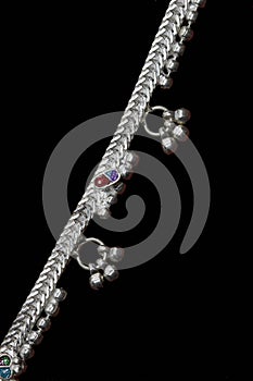 Three Curly silver anklet for catalogue design book