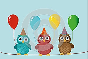 Three cute colored owls sitting on a rope and holding balloons.