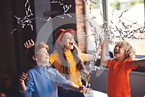 Three cute kids celebrating bithday and enjoying