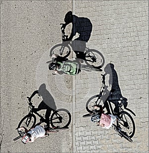 Three cyclists