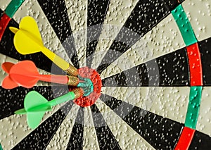 Three darts in the center of the target