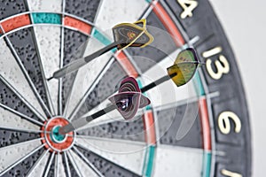 Three darts in dartboard