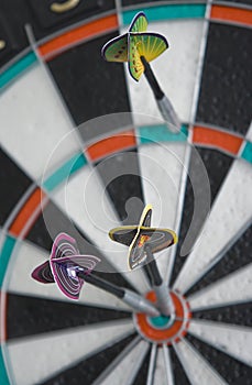 Three darts in dartboard