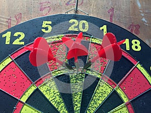 Three darts hitting perfect 180 score.