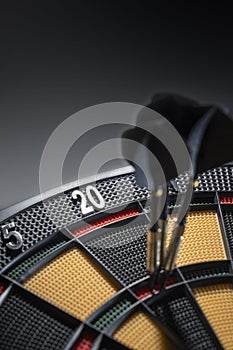 Three darts in triple 20 of dartboard.Ton 80