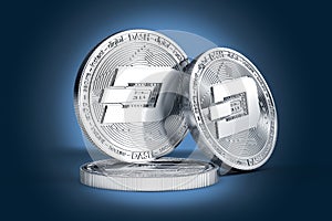 Three Dash concept physical coins displayed on gently lit dark blue background.