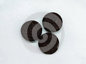 Three delicious looking chocolate biscuits on a white background