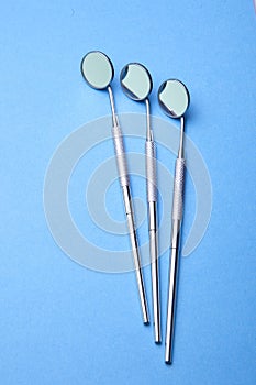 Three Dental Instruments - Angled Mirror photo