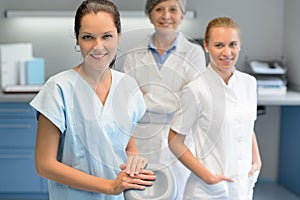 Three dentist woman team at dental surgery