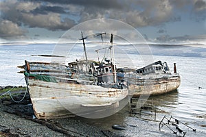 Three derelict fishing trawlers