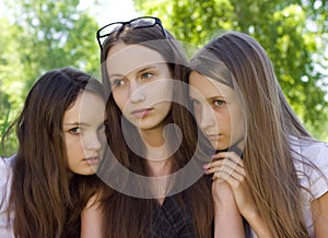 Three despondent student girl outdoor photo