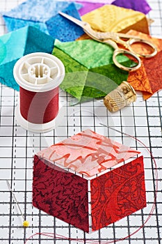 Three diamonds, which will be sewn in the form of a cube, which will form the basis of the future patchwork quilt