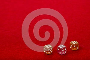 Three Dice with Value 6 on Red Velvet Playing Table - Gambling and Game Concept for Luck and Chance Games