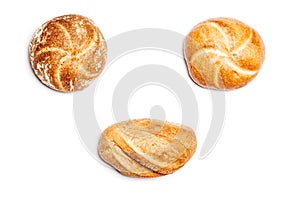 Three different bread rolls on white background, high angle