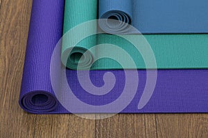 Three different coloured yoga mats