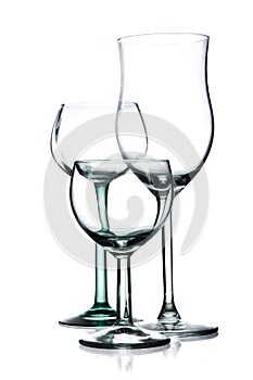 Three different empty wine glasses isolated on a white background