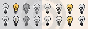 Three different light bulbs are displayed in various shades of light