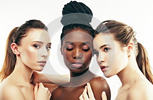 three different nation woman: african-american, caucasian togeth