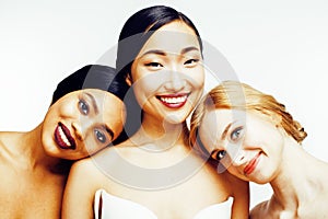 Three different nation woman: asian, african-american, caucasian together isolated on white background happy smiling