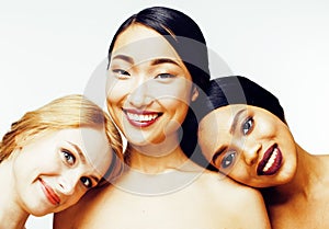 Three different nation woman: asian, african-american, caucasian together isolated on white background happy smiling