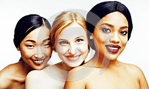 Three different nation woman: asian, african-american, caucasian together isolated on white background happy smiling