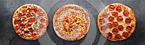 Three different pizzas in panoramic composition photo