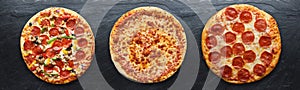 Three different pizzas in panoramic composition